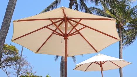 pov of the underside of a canvas beach umbrella