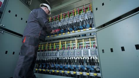 checking the operating voltage levels of the solar panel switchgear compartment