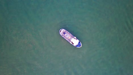 bird's eye shot looking straight down on a boat in the gulf of finland