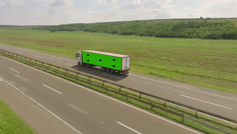 truck on highway with green screen trailer