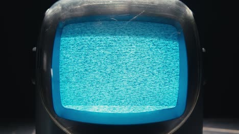 retro tv, vintage television in a nostalgic setup, a retro tv displays grain on screen, scary halloween night device good for chroma key and green screen. high quality 4k footage