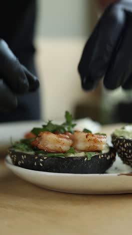 chef preparing shrimp avocado sandwiches