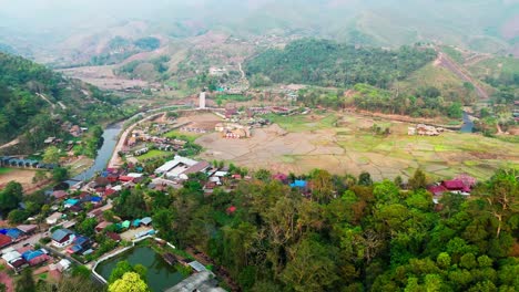 drone above sapan village in mueang nan district, northern thailand rice field and river in mountains landscape