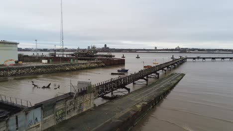 Drone-view-Tranmere-oil-terminal-Birkenhead-coastal-petrochemical-harbour-distribution-Merseyside-push-in-fast