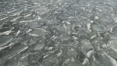 Broken-ice-sheets-ripple-with-waves-LOW-ANGLE-AERIAL