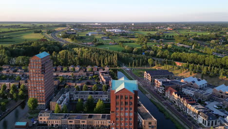 Aerial-view-at-golden-hour-with-modern-buildings-at-Amersfoort-Vathorst,-The-Netherlands