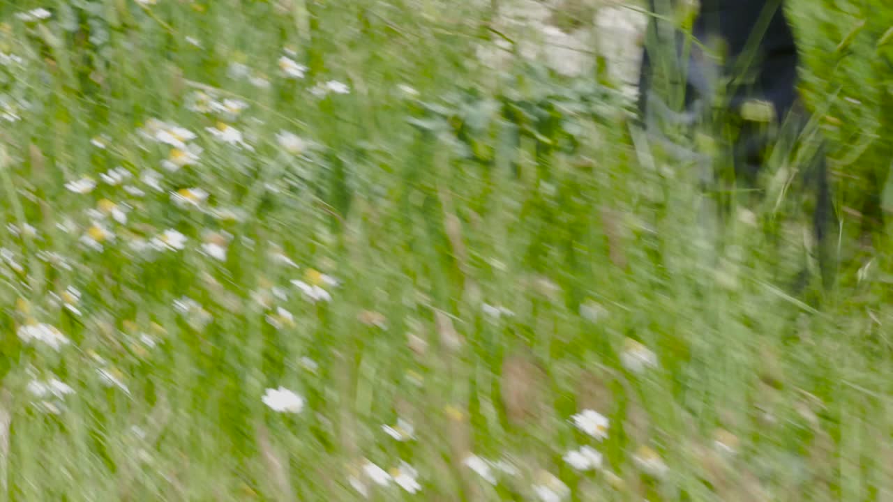 A shot of a hiker´s feet walkins with trekking sticks