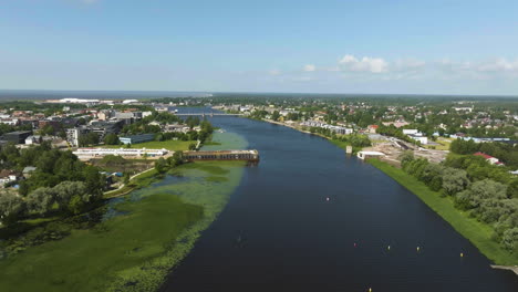 aerial view following the parnu river, sunny. summer day in estonia