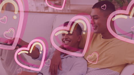animation of hearts over happy biracial male gay couple