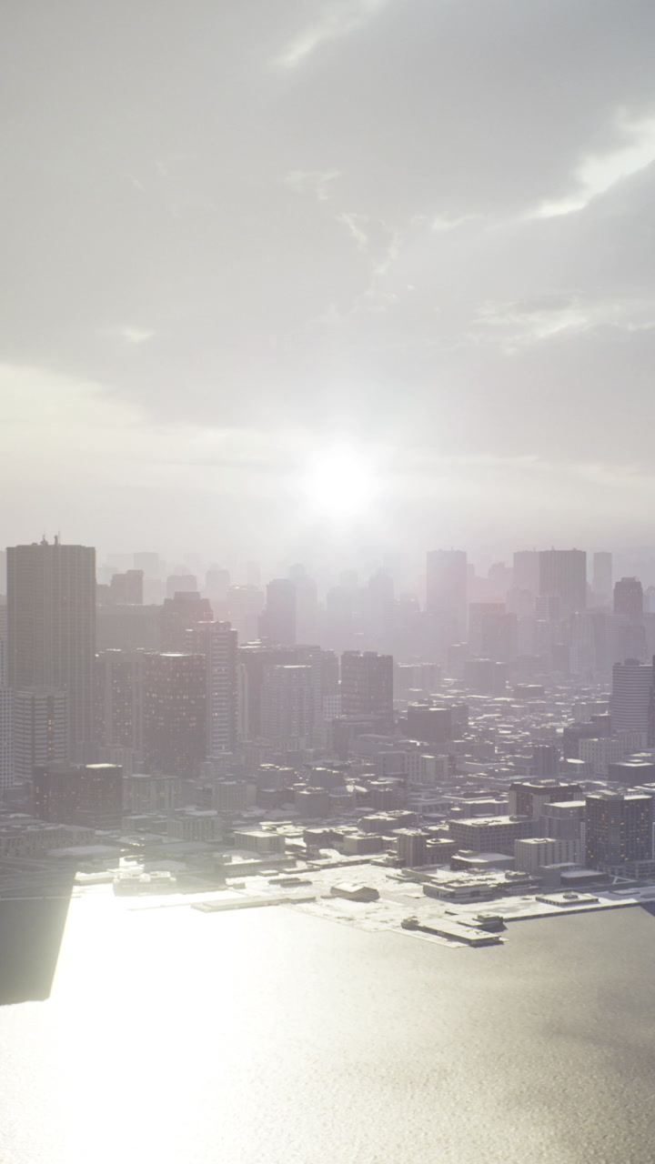 View of a city skyline during sunset with reflections on water surface