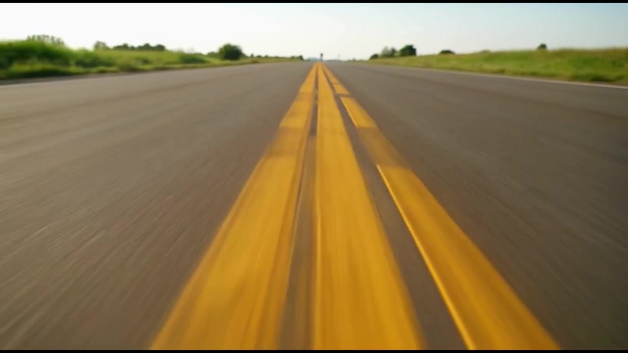 Low Angle View of Driving Down an Empty Country Road