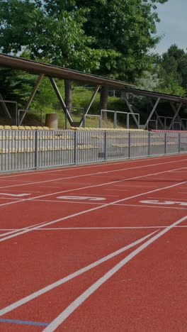 athlete resting on a running track