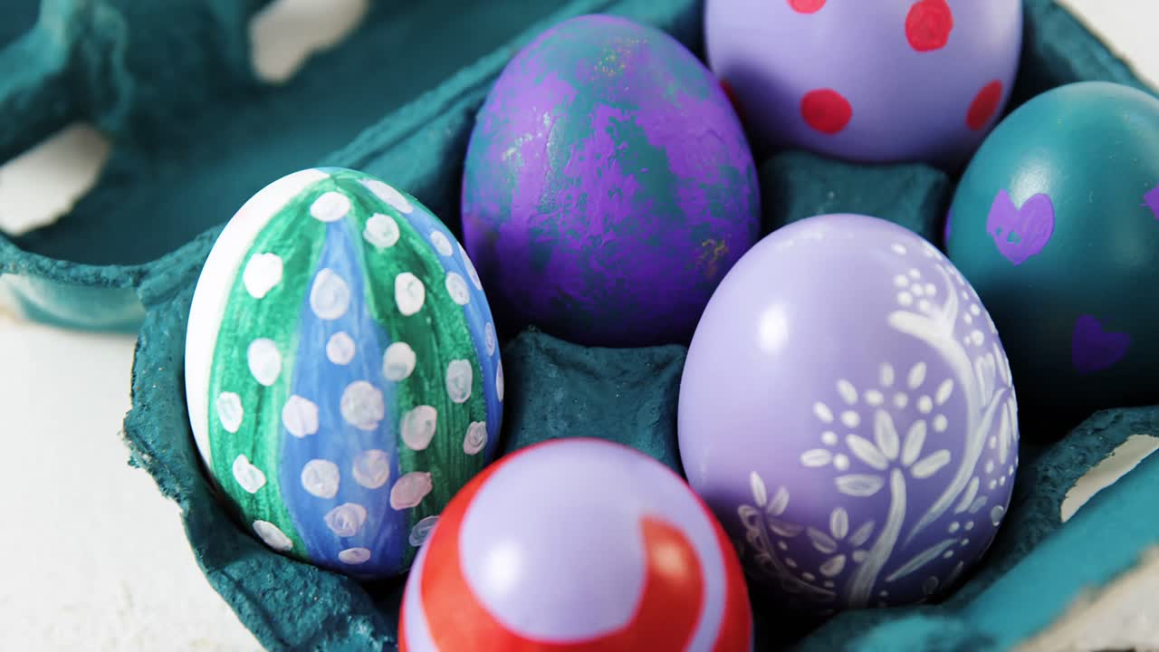 Painted Easter eggs in the carton