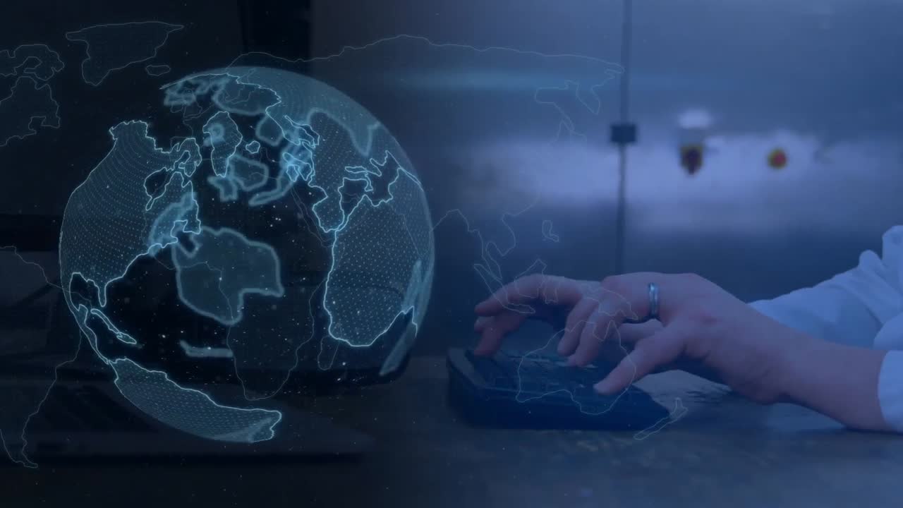 hombre escribiendo en el teclado y el globo digital