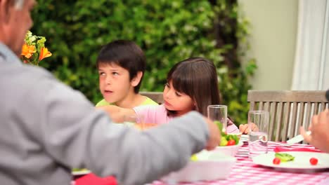 family eating in the garden