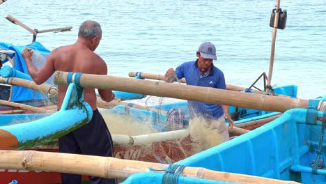 local fisherman of indonesia in traditional boats, slow motion view