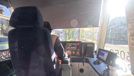 tram operator navigating sunny melbourne route