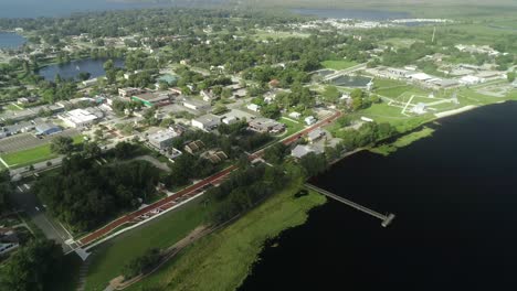 "clermont, fl - usa - 8-24-2020: aerial video clip of downtown clermont and lake minneola