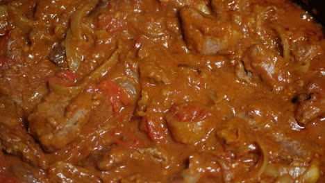 indian beef curry being slow cooked