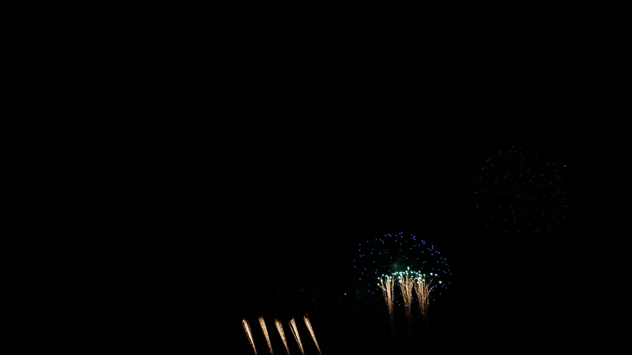 4K. loop seamless of real beautiful fireworks background during new year's eve countdown celebration, real golden shining fireworks festival in the sky at night with colorful. glowing fireworks show.
