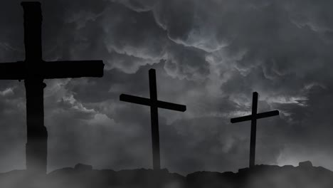 three cross pillars silhouetted against the background of a thunderstorm in the sky