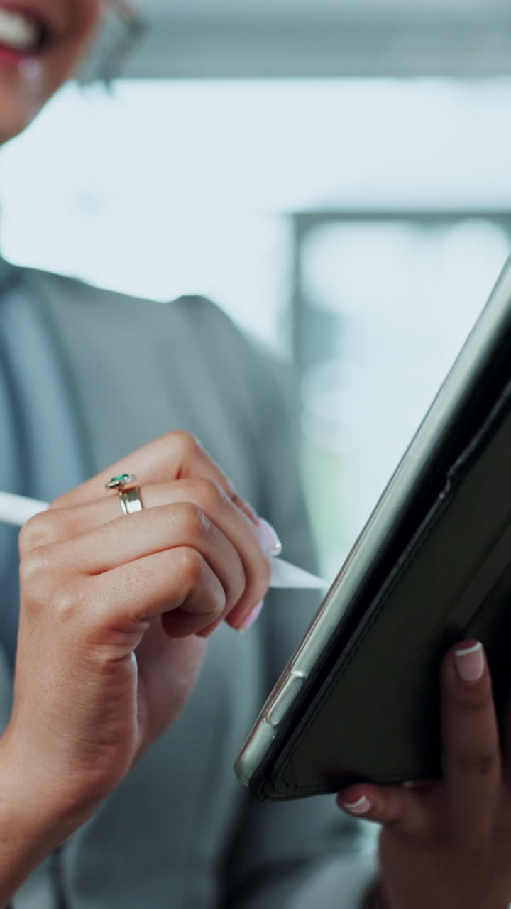 Woman using a tablet with a stylus