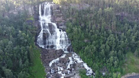 wide shot of the tvindefossen waterfall in norway