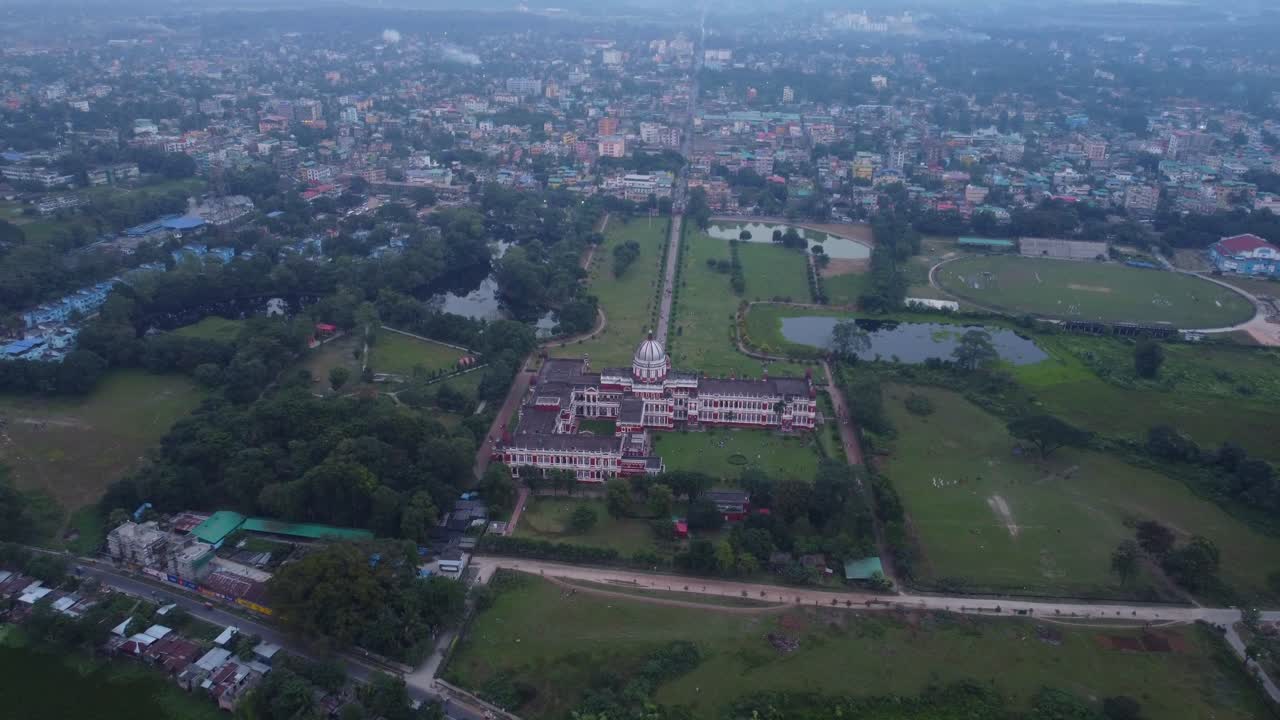 Historical monument Cooch Behar Palace on the bank of River Torsa in Cooch Behar city, West Bengal, Panoramic drone view