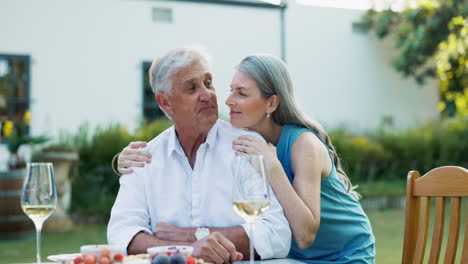 happy senior couple enjoying an outdoor dinner