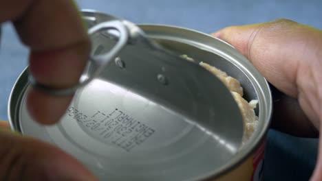 opening a can of food