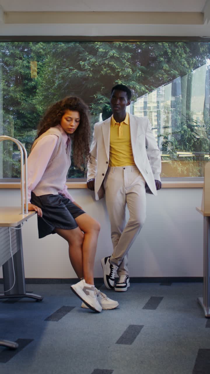 Fashionable Man and Woman in Office Setting