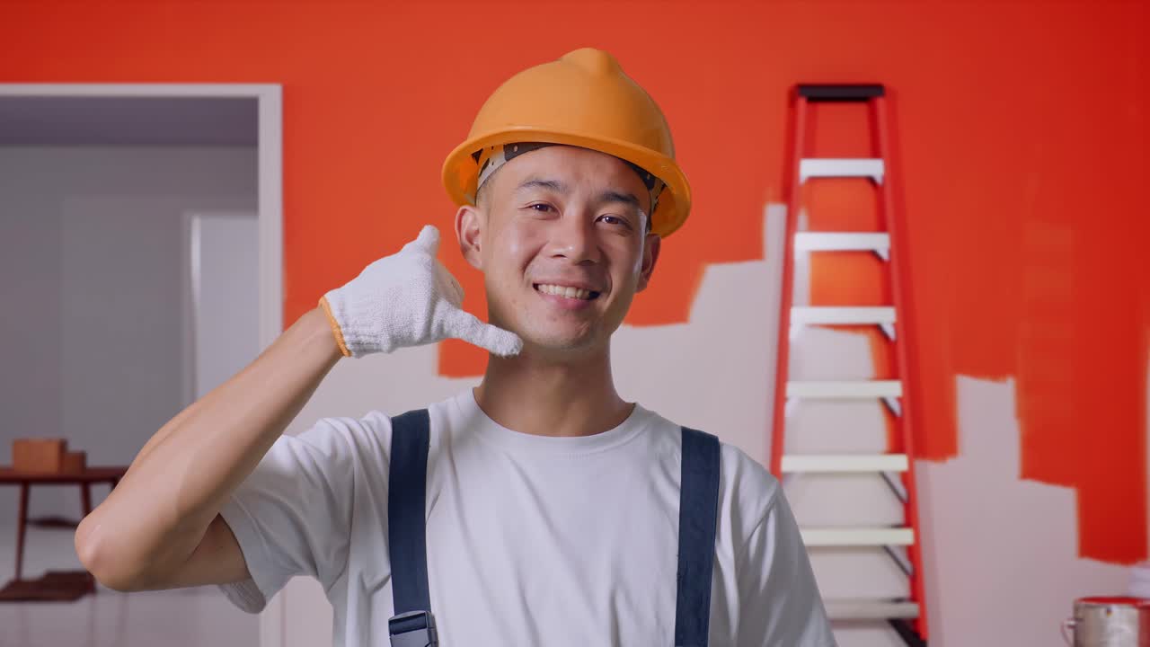 Construction Worker Gesturing to Call