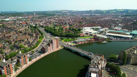 Aerial GV reveal of Belfast City Centre, Northern Ireland, UK on a bright and sunny day. Produced in 4K, 60FPS and with Rec709 color