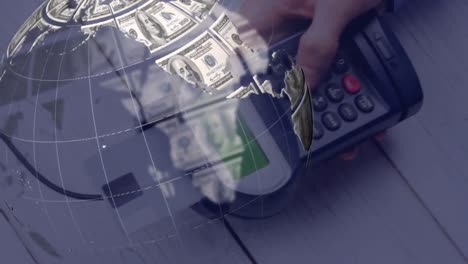 animation of globe made of dollars over payment terminal