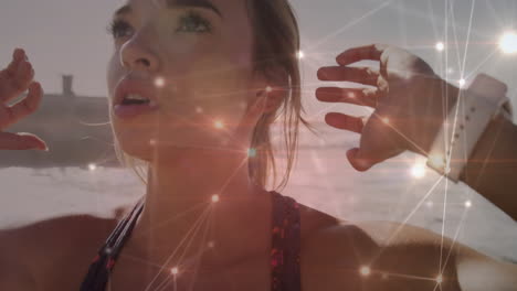 glowing network of connections against caucasian woman performing abs exercise at the beach