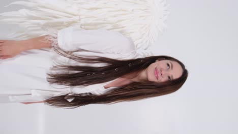 happy woman with angel wings on a white background happy woman with angel wings on a white background angel wings isolated