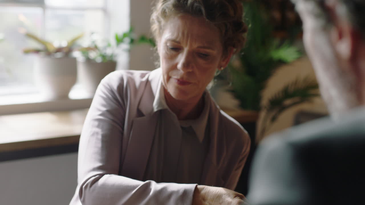 business people in cafe using tablet computer working online collaborating on mobile technology networking together partners brainstorming sharing ideas discussing research close up