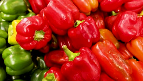 colorful bell peppers displayed at a market stall