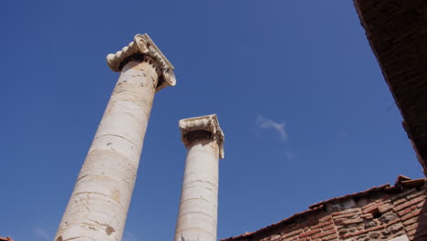 looking up at the sky with pillars of the temple of artemis in sardis