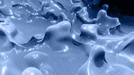 smooth animation of liquid black gradient in 4k. glossy paint surface as abstract looped stylish background. glitters in viscous liquid with 3d splashes on surface like drops. monochrome