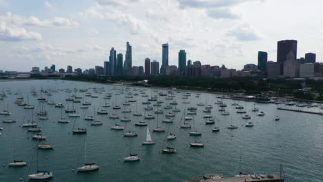 aerial view over moored boats at the monroe harbor, in partly sunny chicago, usa