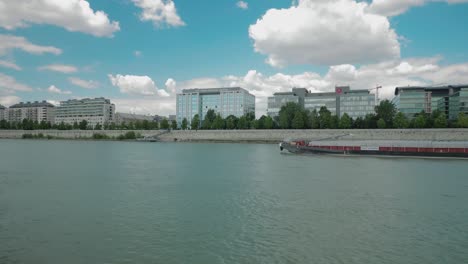 Boat-ride-through-Danube,-summer-afternoon,-cargo-ship,-German-flag