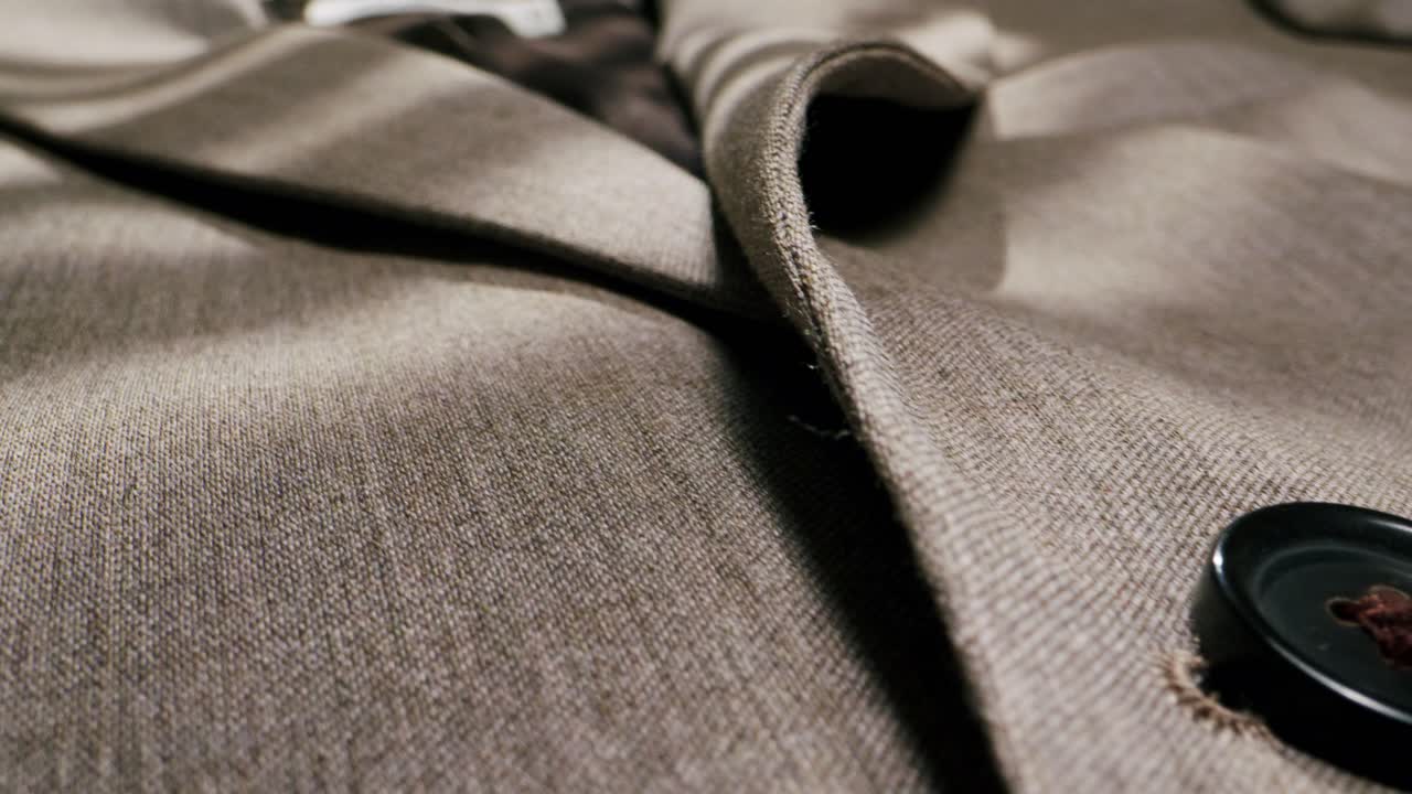 Close-up of a Beige Suit Jacket with Button Detail