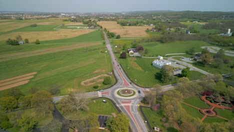 traffic circle with vehicles traveling on it