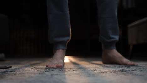 Closeup of man&#039;s feet on the floor