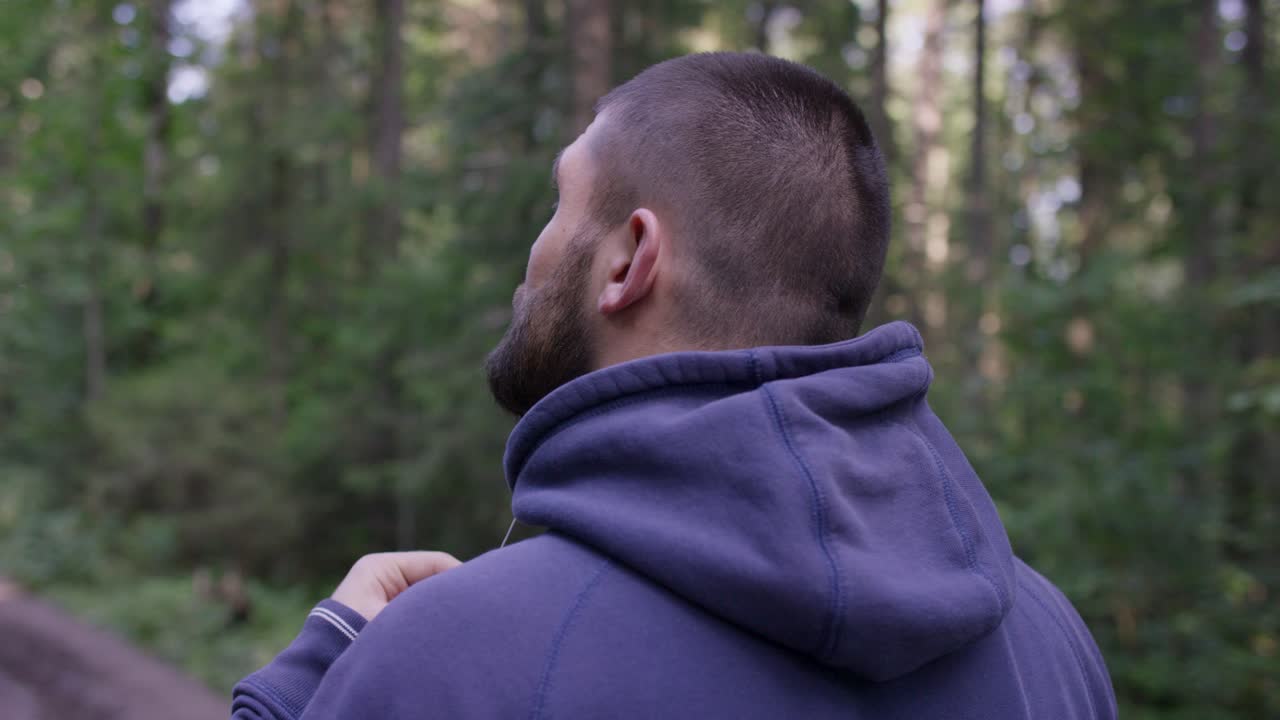 Man Hiking in a Forest