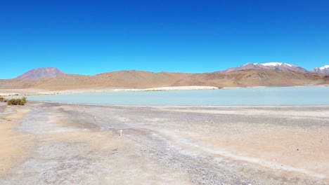 Laguna-Route-in-Bolivia,-Sand-Desert-Formation-and-Salt-Water-Lake-Lagoon,-Travel-Destination-along-Andean-Cordillera,-Altiplano