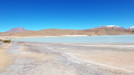 laguna route in bolivia, sand desert formation and salt water lake lagoon, travel destination along andean cordillera, altiplano