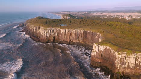 epic aerial view of cliffs on atlantic ocean, guarita park, brazilian conservation unit located in the southern region, state of rio grande do sul, torres city