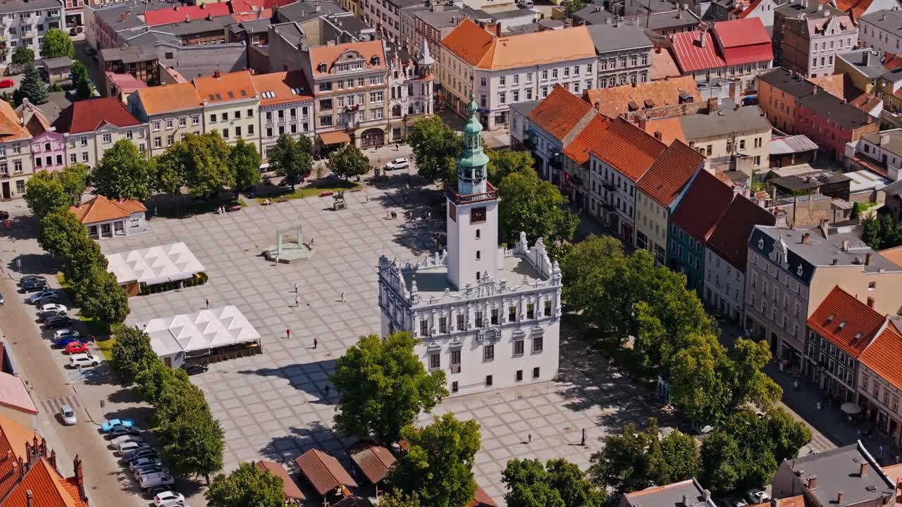 Establishing shot of Chelmno Poland town hall square, historic architecture